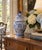 A classic blue and white ginger jar, decorated throughout with delicate Chinoiserie floral motifs. The pattern is dense...