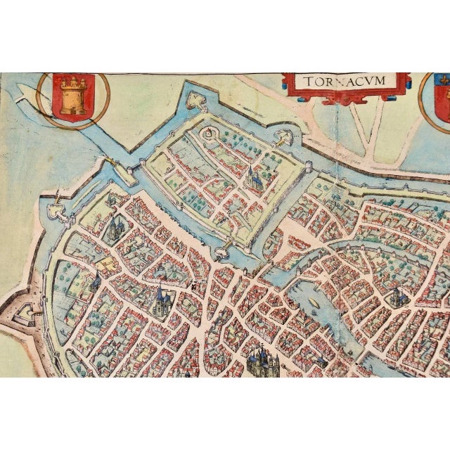 This is a 16th century original hand-colored copperplate engraved map of Tournai, Belgium, entitled "Tornacum" by Georg...