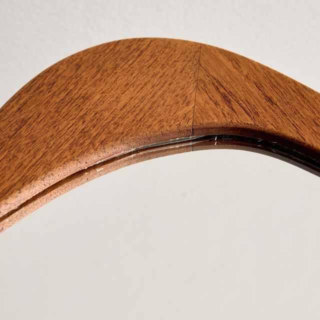 Organic shaped teak framed mirror from the 1960s. The mirror has been completely restored.