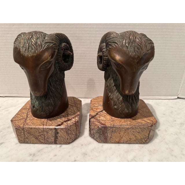A very handsome vintage pair of ram’s head bookends by Theodore Alexander. Marble plinths; good heavy weight.