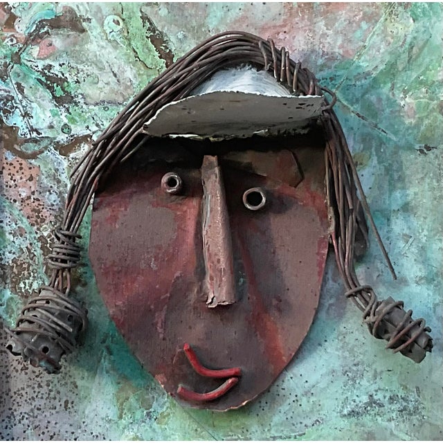 a captivating piece of contemporary, industrial-inspired wall art that marries rugged materials with soulful expression....