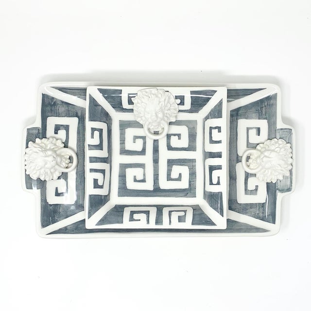 A rectangular tray finished in a solid graphite glaze with a hand-painted Greek key border along the edge. Made in Italy....