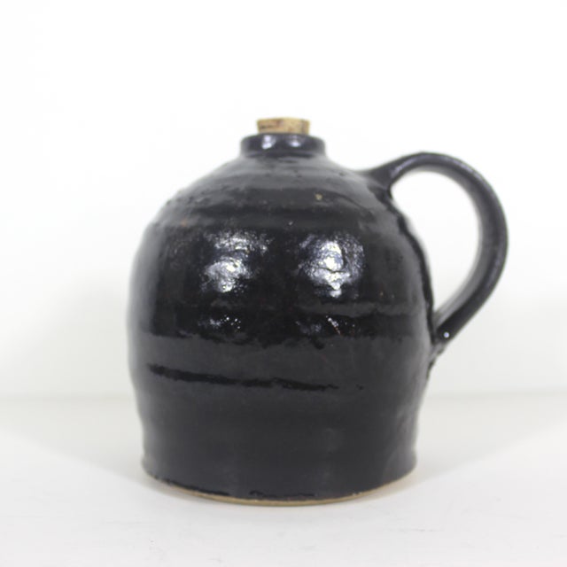 Vintage black stoneware beehive jug. This has a nice rustic glaze, as seen in the photos. Great farmhouse kitchen decor....