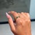 This Modern Wavy Band Ring features 0.10 carat natural marquise-cut emerald, set in 14k yellow gold. The marquise cut...