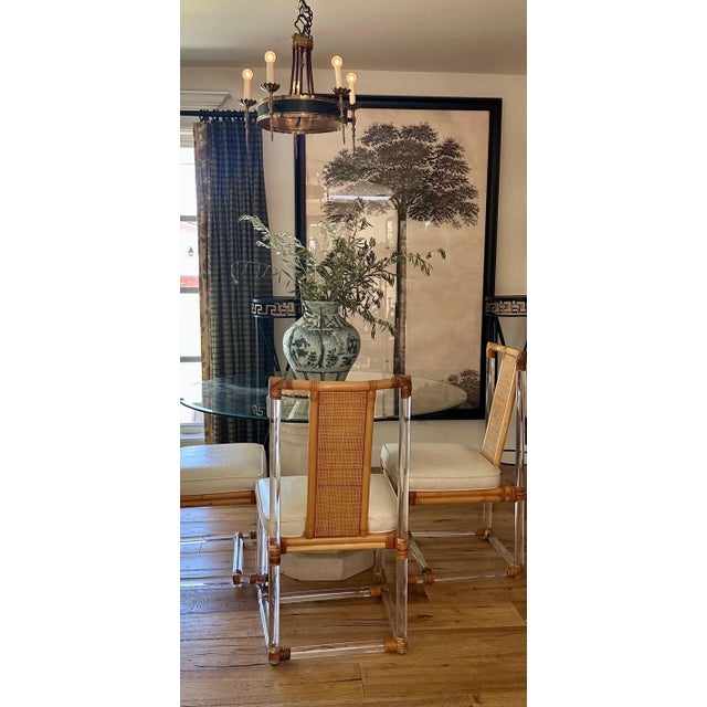 Glamorous set of (3) Mid-Century modern dining chairs, a rare and unusual combination - clear Lucite, bamboo and woven...