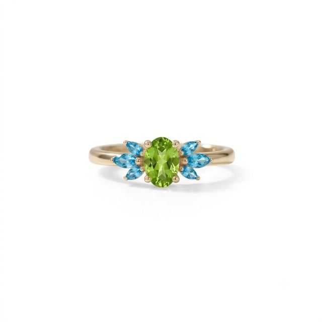 Embrace vibrant color and striking design with this beautifully crafted Oval Peridot and Blue Topaz Cluster Ring. At its...