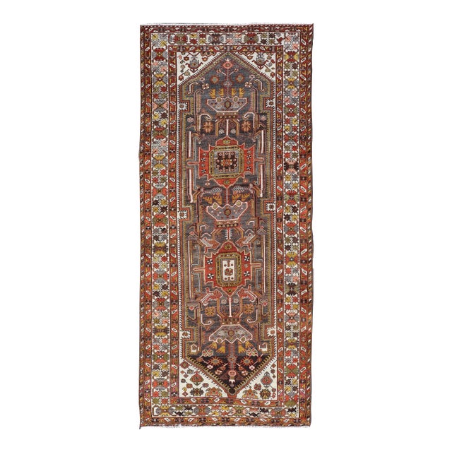 Antique Persian Bakhtiar Gallery Rug Featuring a Multi-Medallion Tribal Design For Sale