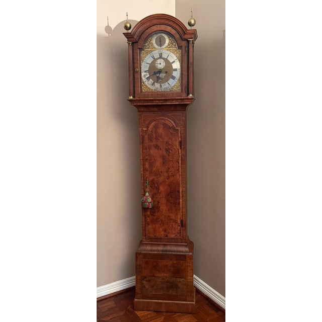 Clock is a rare example of the late "Walnut period" tall case clock, made in London by Jho. Meredith (d.1758). The "eight-...