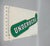 A decorative metal sign “Underberg” with a thermometer for the range -30 to + 50 °C. The thermometer is functional. The...