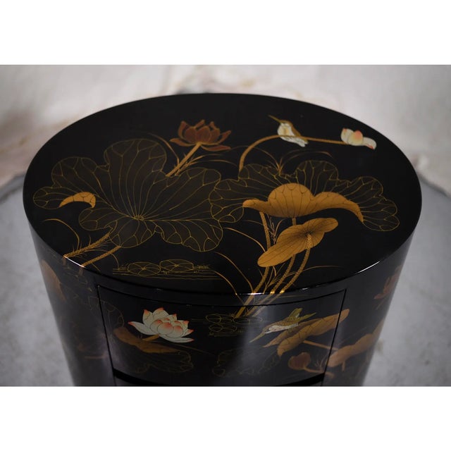 Vintage Chinoiserie oval shaped 2-drawer chest, black lacquered with hand-painted birds & lotus motif in shades of blush,...