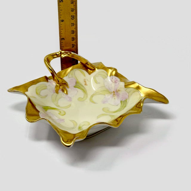 Beautiful antique Bawo & Dotter Elite Works Limoges France handled nappy dish, featuring an elegant floral design and...