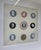 This elegant framed piece features a curated collection of nine authentic 20th-century Wedgwood Jasperware unglazed...