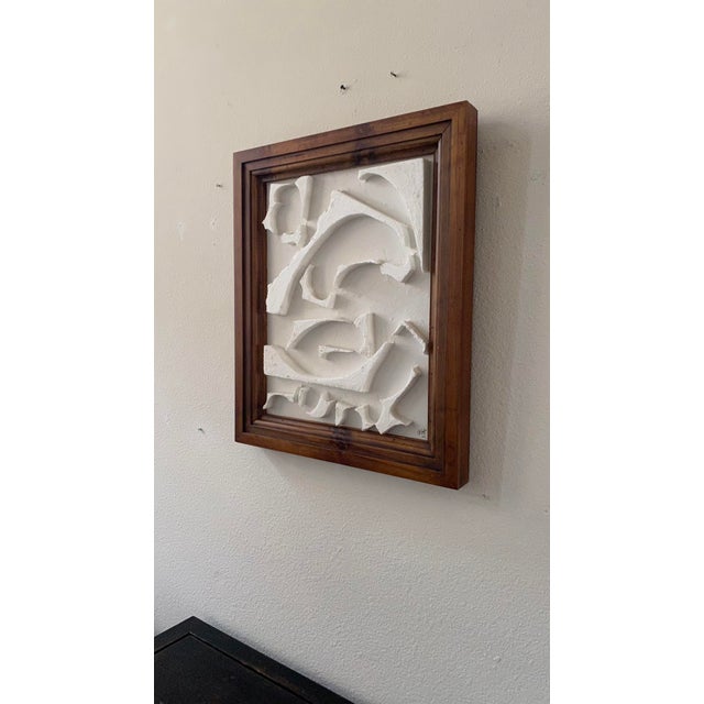 Artist John Paul San Pedro Plays with form and shadow Abstract #9 Framed in an architectural wood Mixed materials on canvas