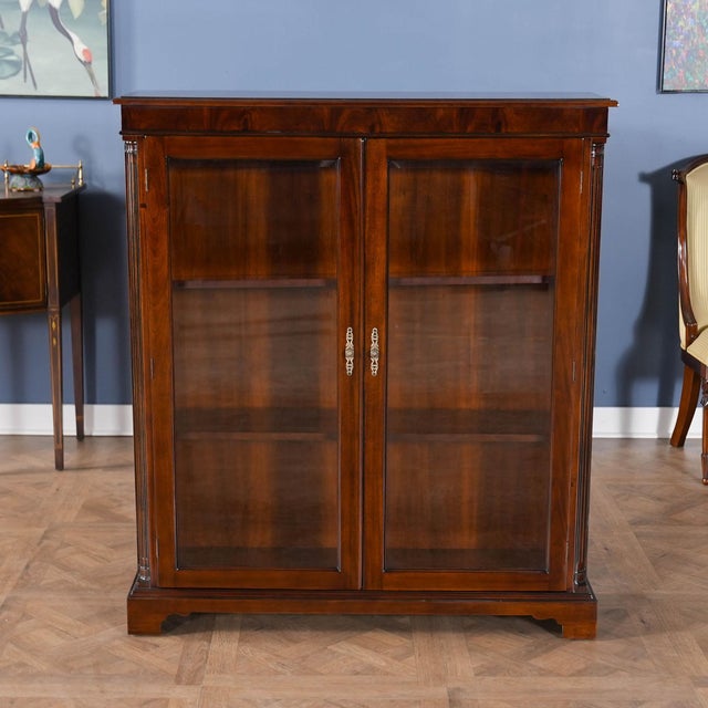 This Mahogany Two Door Bookcase from Niagara Furniture can be used to display your most valued collectables. This bookcase...