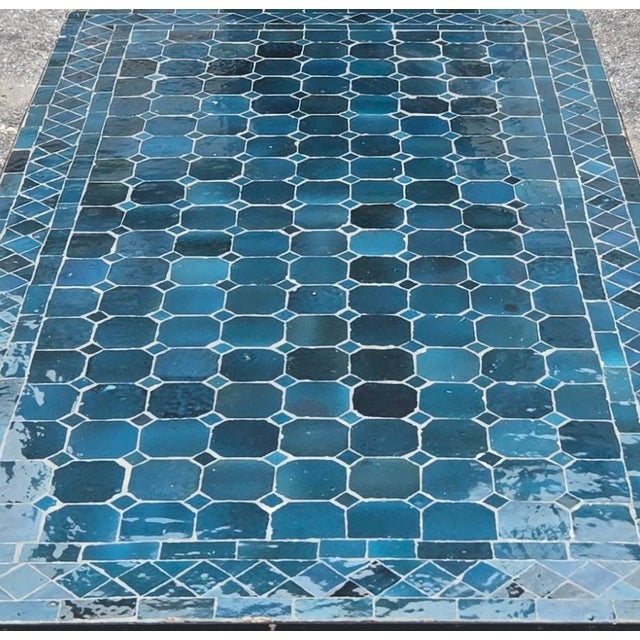 Bring authentic Moroccan craftsmanship to your home or patio with this striking petrol blue mosaic table. The rectangular...