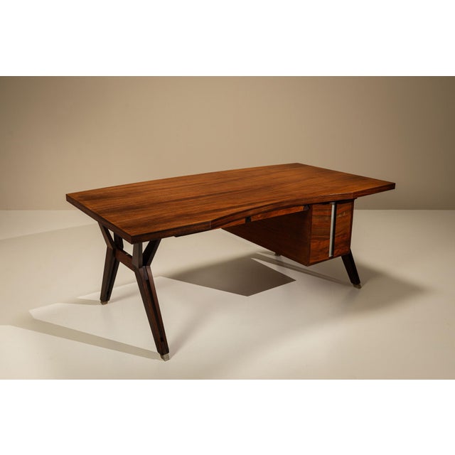 A sculptural approach to function defines this italian writing desk, where structure and material are held in careful...