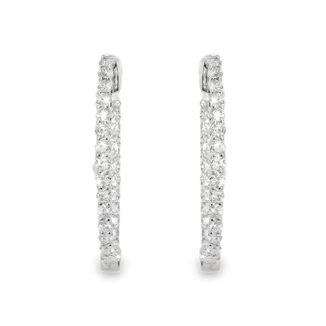 14K white gold hoop earrings with 58 brilliant round diamonds totaling 1.9 carats. Each earring measures 1.25 inches long...
