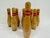 Vintage set of 9 wooden bowling pins with classic red stripe detail and turned wood construction. Natural wood finish with...