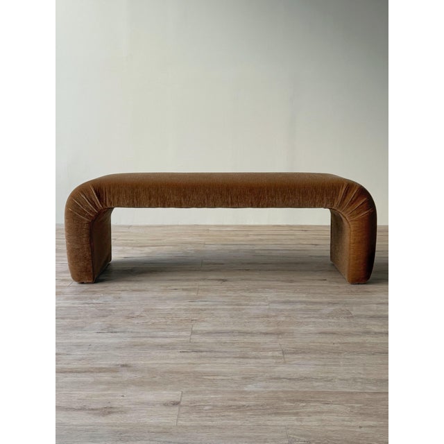 Vintage 1980s waterfall bench, newly reupholstered in champagne cut mohair. The elongated seat curves downward at both...