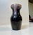 Early Danish Pottery vase with subtle Art Nouveau/Jugend styling and shape. Unusual plum and bone-toned glazes. Designed...