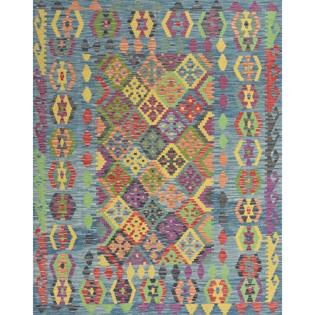 This tribal geometric Kilim rug is handwoven with all wool on a wool foundation. This rug is new and in excellent...