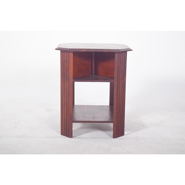 Octagonal side table. With two lower shelves, it is ideal as a functional and decorative element in various areas of the...
