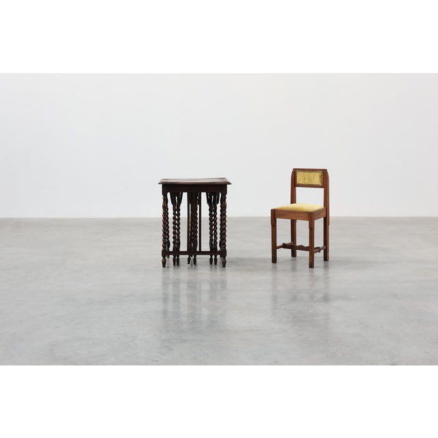A distinctive English nesting table set dating from the early twentieth century, comprising one rectangular host table and...