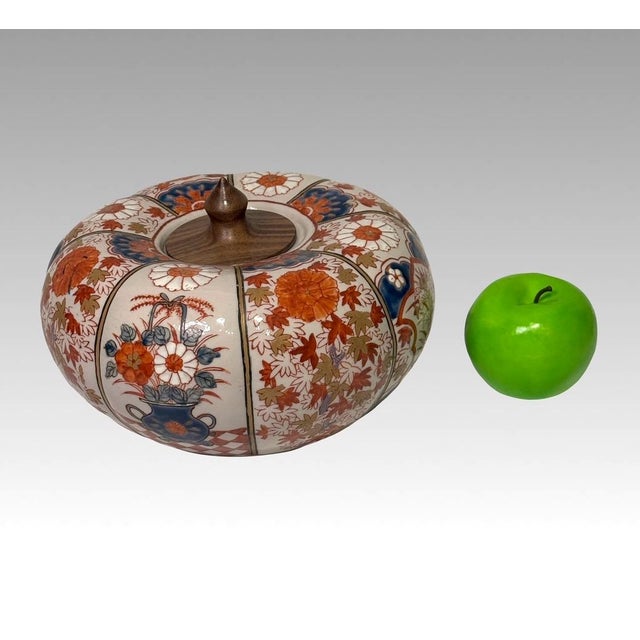 Very unusual lobed form Japanese 'ginger jar', each section hand painted in colourful floral arrangements. Primarily in...