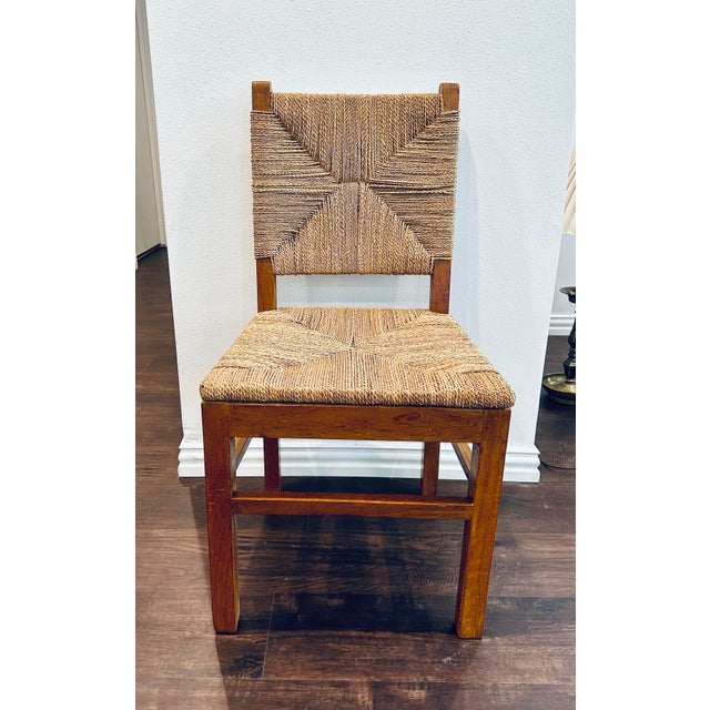 This solid wood dining / side chair features a solid oak wood frame with a handwoven seat and backrest made from natural...
