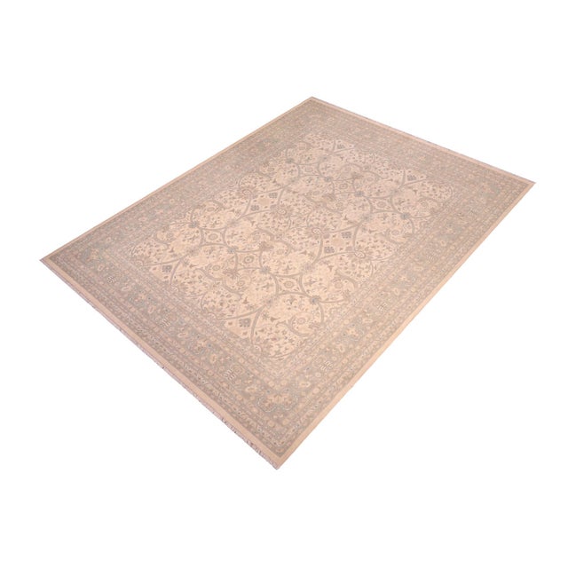 Enhance the ambiance of your home with this magnificent Persian-influenced Turkish hand-knotted rug made by skilled...