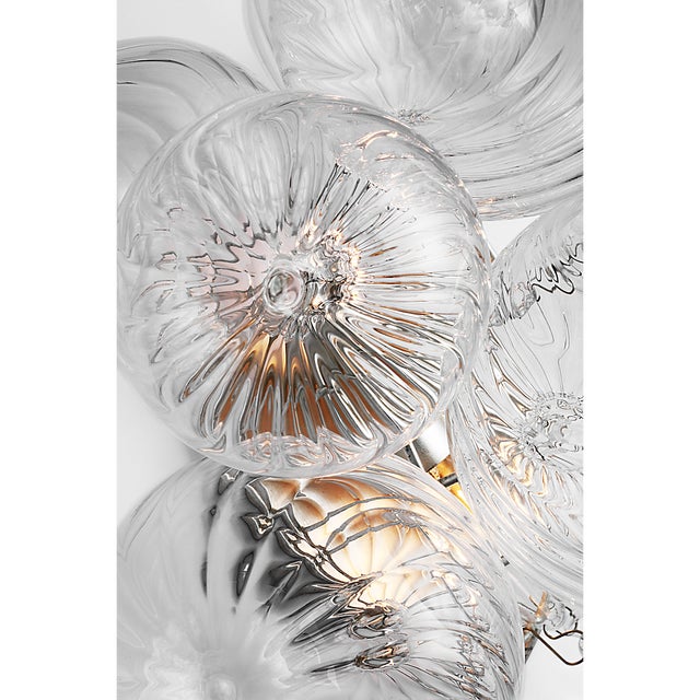 Description: Artisanal glass elevates the Talia series by Julie Neill, offering a new take on the simple glass globe light...