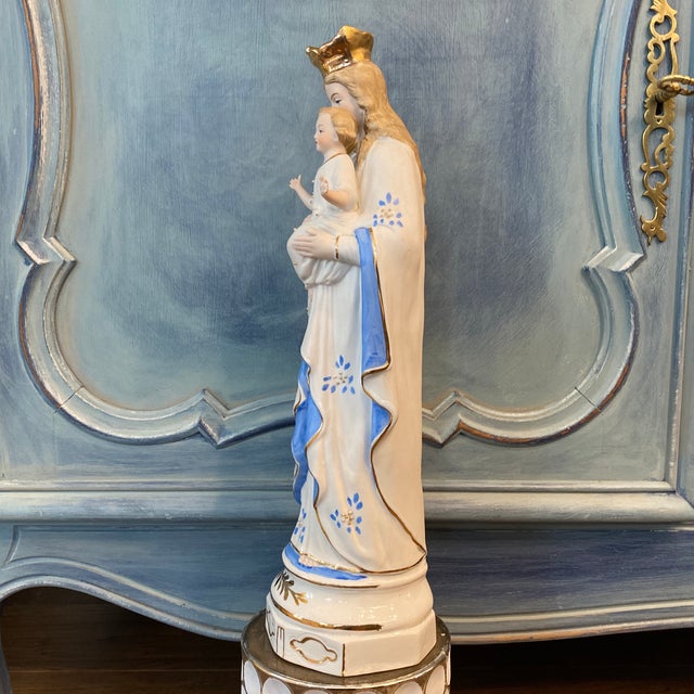 French antique bisque porcelain statue of Our Lady holding Infant Jesus. Vibrant colors and no fading of paint or gold...