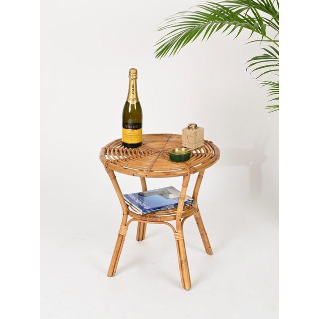 Wonderful Mid-Century two-tier round coffee table in curved bamboo, rattan and hand-woven wicker. This stylish organic...