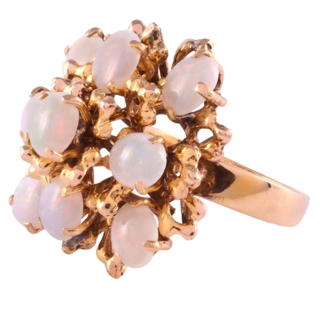 This is part of Chairish’s Fine Jewelry assortment. Vintage oval opal cocktail ring, circa 1950-60. This 12 karat yellow...