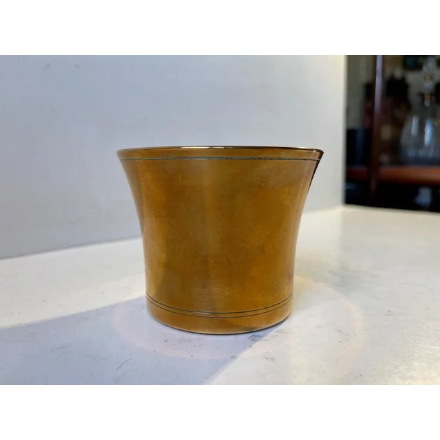 Small patinated vase in light bronze designed by Just Andersen and manufactured in the early 1930s. Fully signed and...