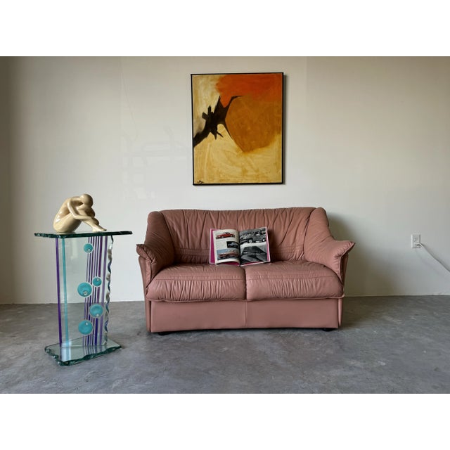 This striking 1980s Italian Postmodern art glass pedestal - side table showcases a bold and vibrant design, emblematic of...