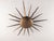This flush mount ceiling lamp takes the form of a sunburst, a motif closely associated with Mid-Century Modern lighting...