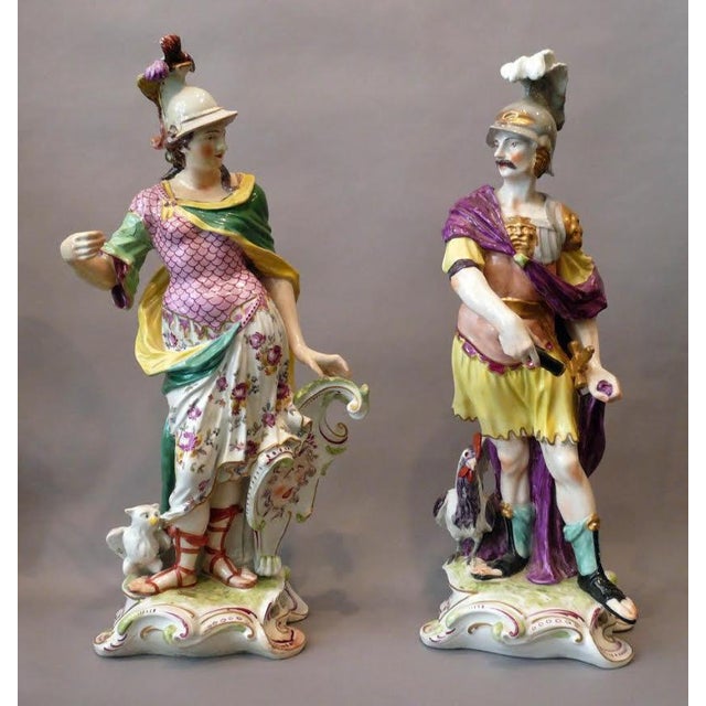 Pair of Chelsie figures, late 18th c. marked gold anchor of Minerva with her owl and shield, and traditional flowing garb,...