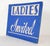 Vintage retail cardboard wall sign with a blue background and white lettering. The sign reads, Ladies Invited". Good...