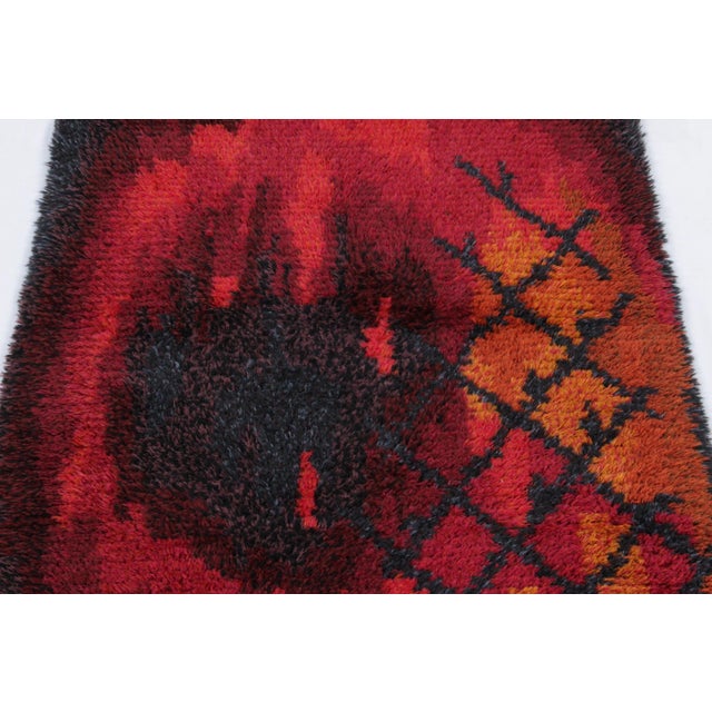 Hand-knotted in lush, high-pile wool in Sweden circa 1960-1970, this 3x5 vintage Swedish Rya rug is a bold new addition to...