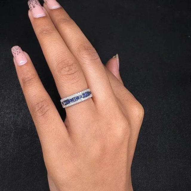 Diamond Blue Sapphire Wedding Ring in 18k Gold featuring natural sapphire of 0.43 carats and diamonds of 0.25 carats. The...