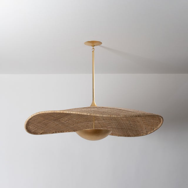 A dialogue between form and material, this nature-inspired design undulates with charm. The interplay of woven rattan and...