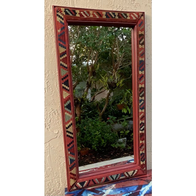 Add a touch of global warmth and artisan craftsmanship to your home with this stunning handmade wall mirror. Framed in a...