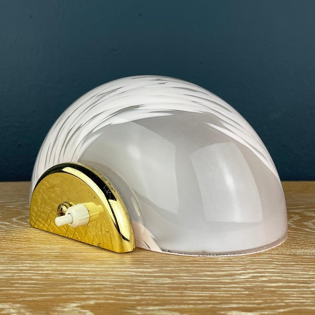 Introducing the charming pink Murano glass sconce, a timeless piece crafted in Italy during the 1970s. Despite its...