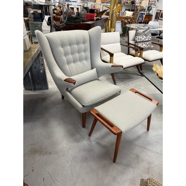 Beautiful Papa Bear chair and ottoman by Hans Wegner manufactured by A.P. Stolen. There is a Danish Circular medallion...
