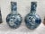 Very large pair of Chinese blue and white vases depicting fish... one with cracked base and repair work.... the other in...