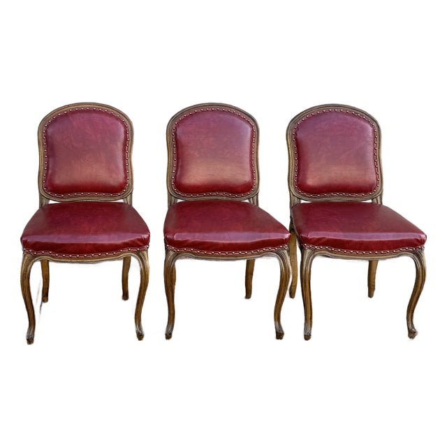 Mid 20th Century Tacked Red Vinyl & Fruitwood French Louis XV Fauteuil Dining Chairs - Set of 3 For Sale