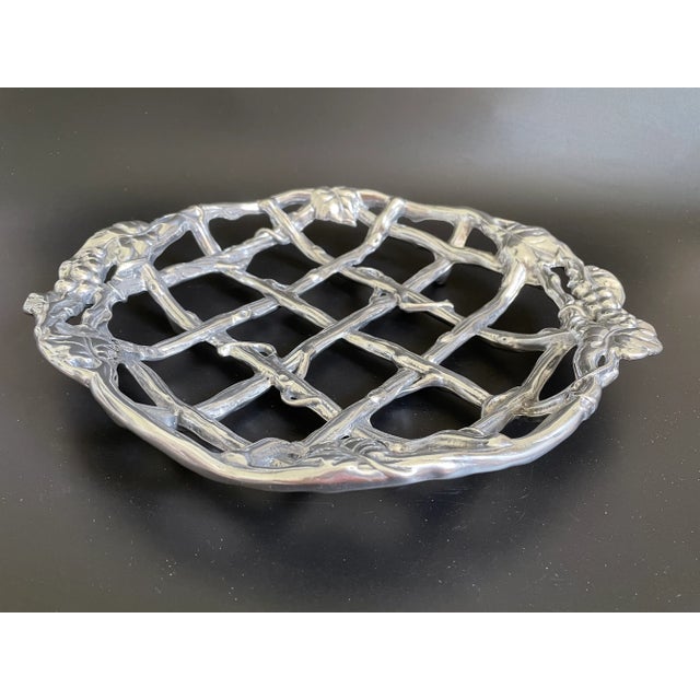 Arthur Court 2000 Aluminum Grape Collection Pie Trivet. Can be used as fruit basket as well. Vines form a chain-link...