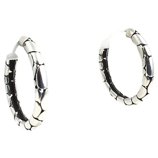John Hardy medium sterling silver post-back hoop earrings featuring blackened detailing with the silver Kali pattern....