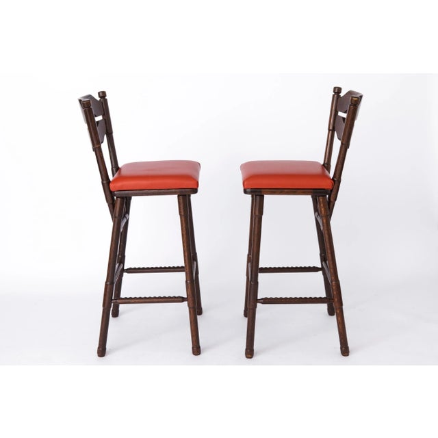 Unique pair of vintage bar stools. Production Period: 1980s German origin. Add a touch of retro elegance to your space...